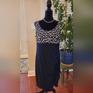 Elegant Navy and White Sleeveless Dress with Matching Jacket.